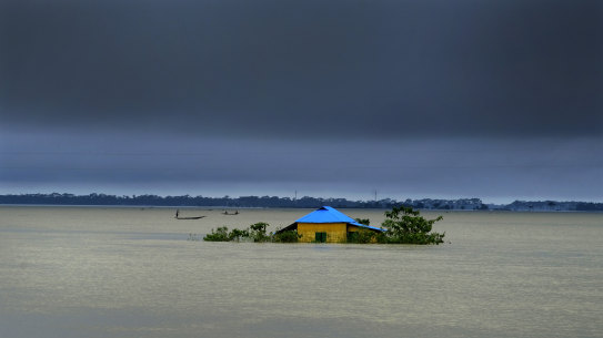 A house in marooned by flood waters in Sylhet, Bangladesh last month.