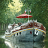 A Belmond barge in the French countryside.