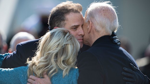 Hunter Biden embraces his father, Joe, and Jill Biden during Joe’s presidential inauguration ceremony in Washington in January.