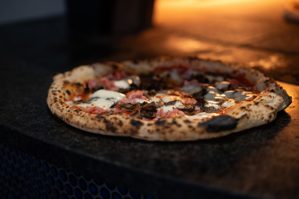 Pizza coming hot out of the oven at Tutto Vero in Oatley.