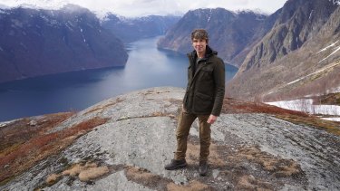 Professor Brian Cox on location at Stegastein, overlooking Aurlandsfjorden in Norway. 