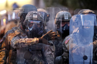 Georgia National Guard troops prepare to enforce a 9:00 pm curfew in Atlanta on Tuesday.