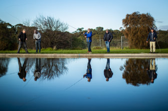 Vin McCaughey (far right) casts his fishing rod over the pools in Yarra Bend Park, Fairfield. 