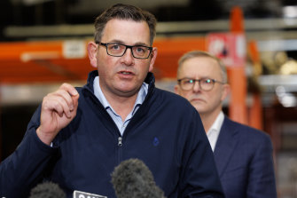 Daniel Andrews with Anthony Albanese behind him on Tuesday.