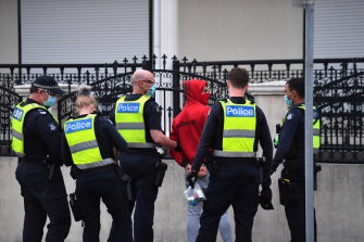 Police detain a man in Dandenong on Thursday afternoon. He was later released.