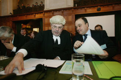 Members of the Palestinian delegation Nasser Al-Kidwa (R), Permanent Observer of Palestine to the United Nations, speaks with James Crawford, to prepare for the opening hearing to discuss the legality of Israel’s controversial separation barrier in the occupied territories, 2004.