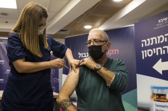 Heart transplant patient Moshe Geva Rosso receives a fourth dose of the COVID vaccine in Ramat Gan, Israel. 