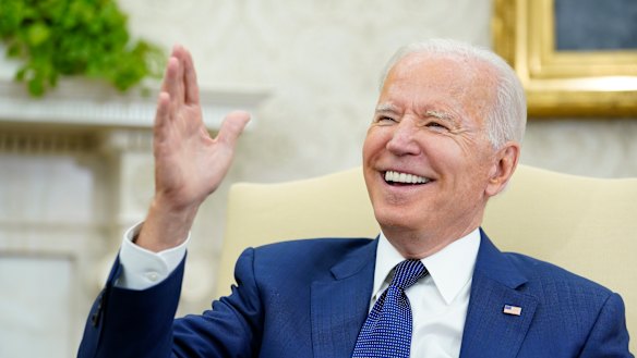 President Joe Biden laughs during his meeting with Iraqi Prime Minister Mustafa al-Kadhimi in the Oval Office of the White House in Washington, Monday.
