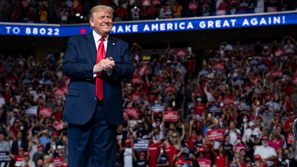 President Donald Trump arrives on stage to speak at a campaign rally in Tulsa in July.