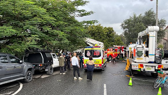 Dozens of police officers, paramedics, fire crews and contractors were on the scene at Kurilpa Commons on Tuesday, a day after riot police were brought in to help barricade it. 