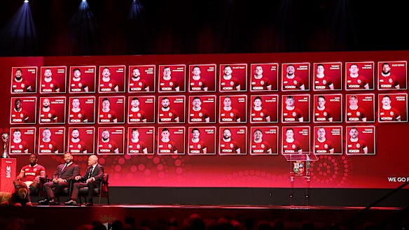 Maro Itoje, Captain of British & Irish Lions, Andy Farrell, Head Coach of British & Irish Lions and Ieuan Evans, Chair and Tour Manager of British & Irish Lions, in front of a screen with the 37-man squad.