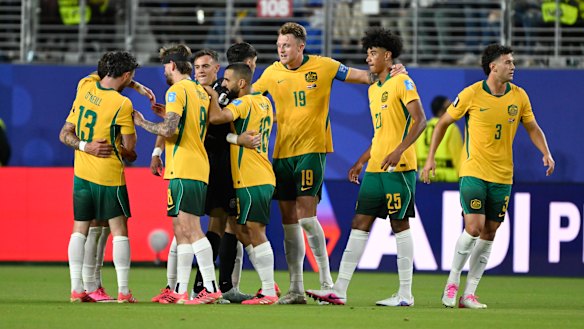 The Socceroos celebrate a great moment in Australia’s World Cup history.