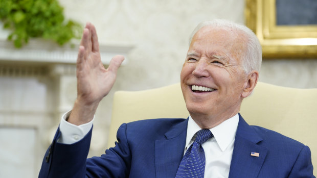 President Joe Biden laughs during his meeting with Iraqi Prime Minister Mustafa al-Kadhimi in the Oval Office of the White House in Washington, Monday.