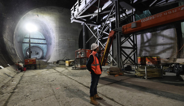 A worker surveys the Victoria Cross Metro station cavern in North Sydney.