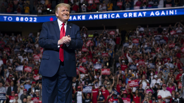 President Donald Trump arrives on stage to speak at a campaign rally in Tulsa in July.