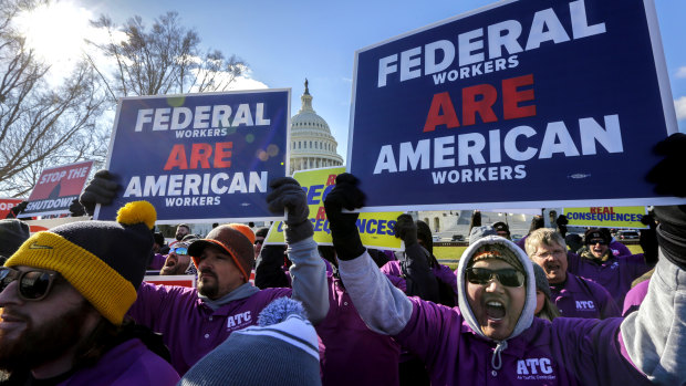 Federal employees rally at the Capitol to protest against the impasse between Congress and President Donald Trump over his demand to fund a US-Mexico border wall.