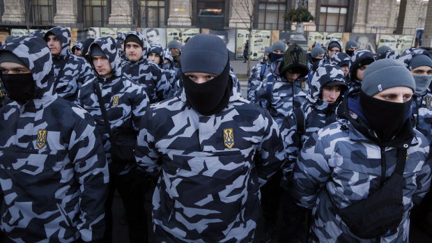 Volunteers with the right-wing paramilitary Azov National Corps stand to attention.