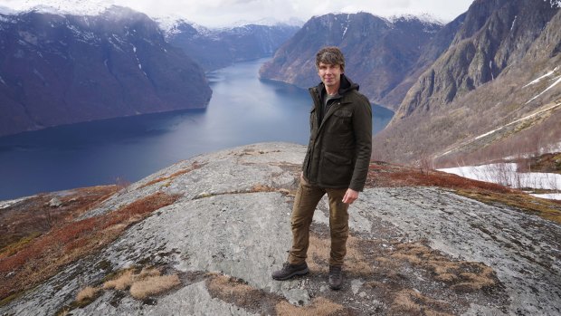 Professor Brian Cox on location at Stegastein, overlooking Aurlandsfjorden in Norway. 