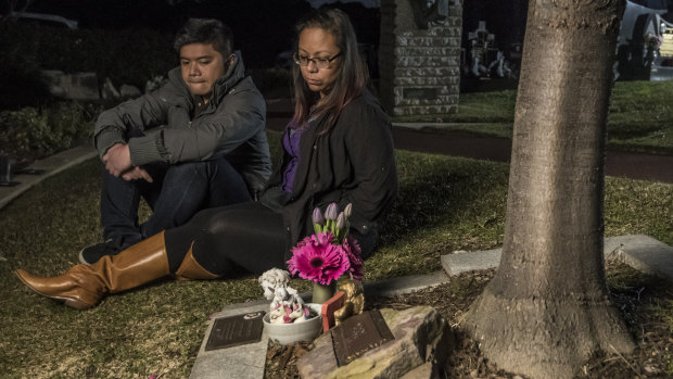 Mitch and Marie Cruz at Caitlin's grave at Rookwood Cemetery.