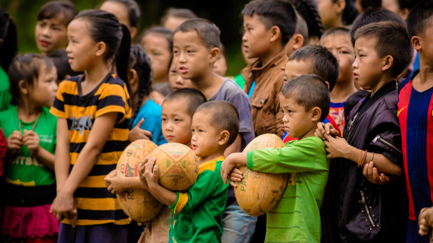 The world game: Children watch on intently at their first rugby training clinic.