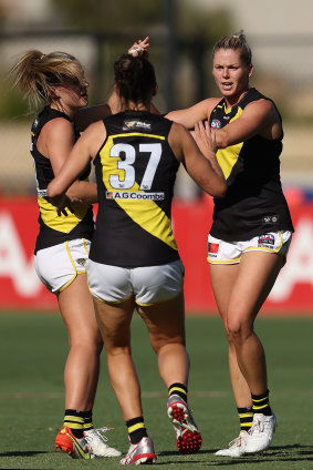 Katie Brennan celebrates with teammates.