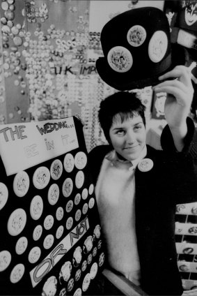 "The Charles and Diana badges are selling out fast at The Badges Shop in Crystal Palace Arcade, Sydney. Shop assistant Phillipa Aldridge with a bowler hat displaying the badges." June 25, 1981