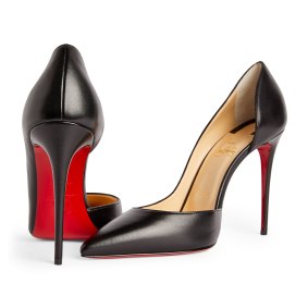 Black pumps are a staple item for Michelle, especially Christian Louboutin’s “Iriza” stilettos.