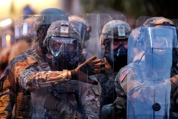 Georgia National Guard troops prepare to enforce a 9:00 pm curfew in Atlanta on Tuesday.