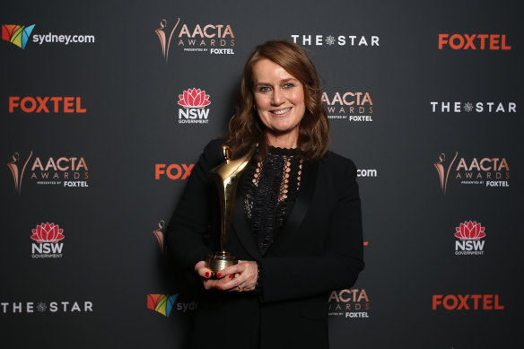 Elise McCredie poses with the AACTA Award for best television screenplay for Stateless.