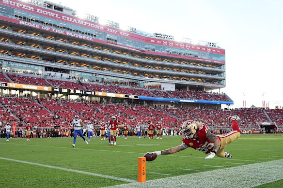 George Kittle of the 49ers dives for a touchdown against the Rams at Levi’s Stadium last November. 