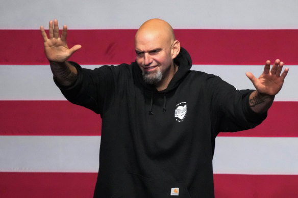 Democratic candidate for US Senate John Fetterman waves to supporters after addressing an election night party in Pittsburgh.