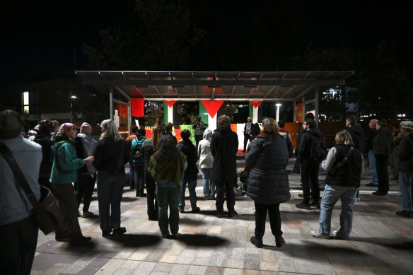 People rally at Deakin University’s Burwood campus on Wednesday evening.