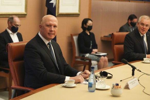 Defence Minister Peter Dutton with Prime Minister Scott Morrison in the cabinet room in December.