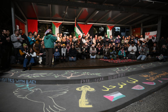 People gather at Deakin University’s Burwood campus on Wednesday evening.