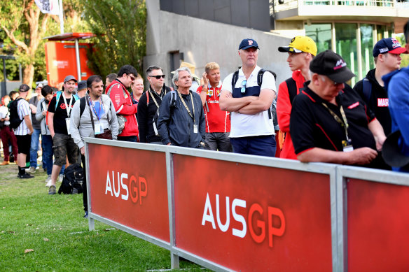 Spectators arrive at Albert Park, as uncertainty hangs over the Australian Grand Prix.