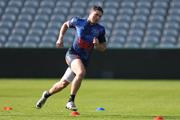 Mitchell Moses runs drills at Blues training on Saturday morning.