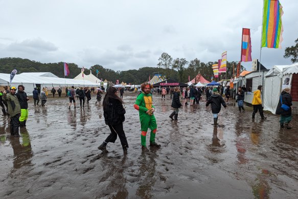 Bring your gumboots: Punters tackle wet conditions at Splendour on Friday.