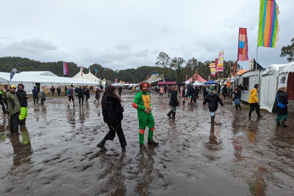Bring your gumboots: Punters tackle wet conditions at Splendour on Friday.