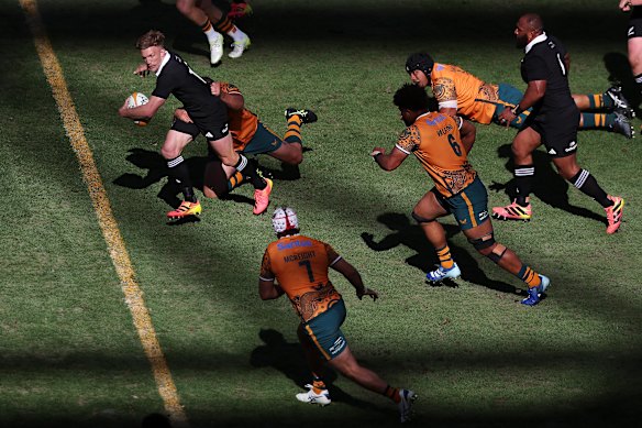 Damian McKenzie makes a break for the All Blacks on Saturday.