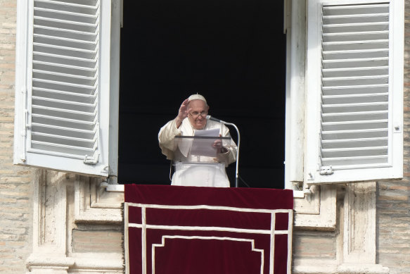 Pope Francis delivers a blessing as he recites the Angelus noon prayer from the window of his studio overlooking St Peter’s Square at the Vatican on Sunday.