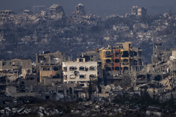 Destroyed buildings by Israeli bombardments as seen inside the Gaza Strip from southern Israel on Thursday.