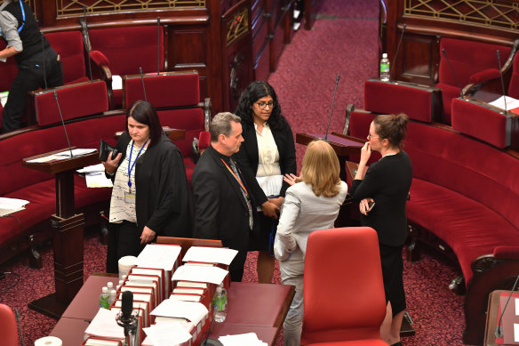 From left, Animal Justice Party MP Andy Meddick, Greens leader Samantha Ratnam, the Reason Party’s Fiona Patten (with her back to the camera) and Labor’s Jaclyn Symes discuss matters in the Victorian upper house.
