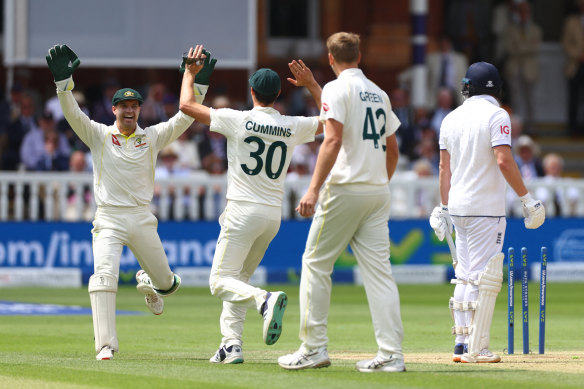 Alex Carey and Pat Cummins celebrate Jonny Bairstow’s wicket.