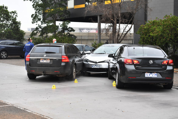 A man was shot by police after he allegedly rammed unmarked police cars in a McDonald's car park.