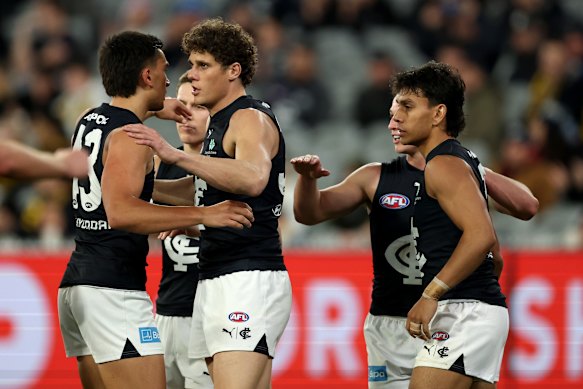 Charlie Curnow of the Blues is congratulated by teammates.