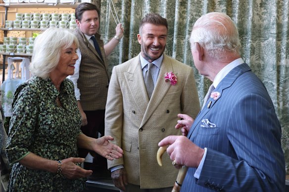 King Charles and Queen Camilla speak with David Beckham at the Chelsea Flower Show in May.