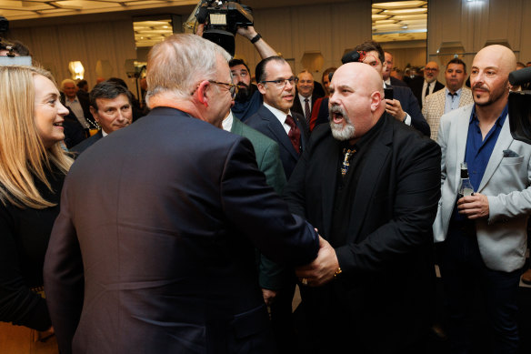 Anthony Albanese is greeted by a fan at last night’s Italian-Australian community event.