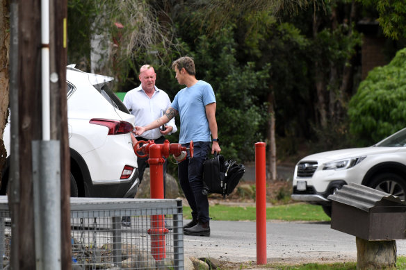 WorkSafe investigators arrive at the caravan park on Saturday afternoon.