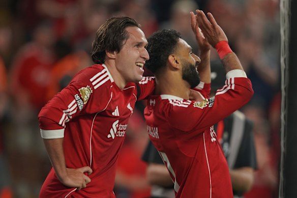 Salah with Chiesa after scoring his side’s fourth goal.