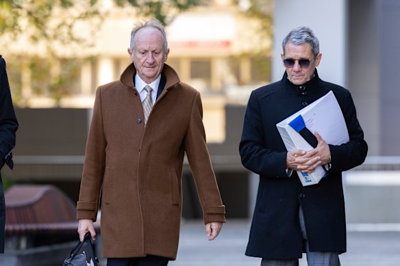 Mark Tedeschi, KC (left), and Shane Drumgold arrive at the ACT Civil and Administrative Tribunal on Monday.